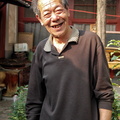 Mr. Liu in his eclectic garden