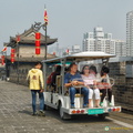 Riders on City Wall Trolley Carts